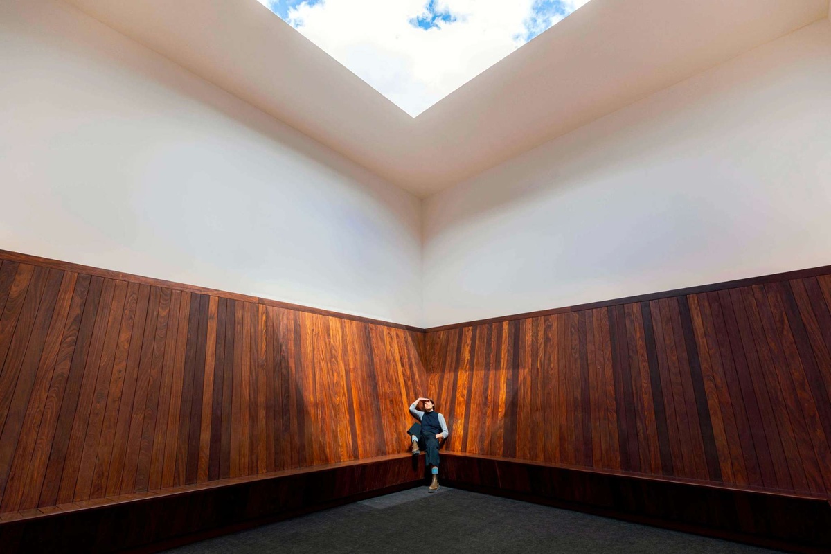 A person sitting in James Turrell's "Meeting" installation. 