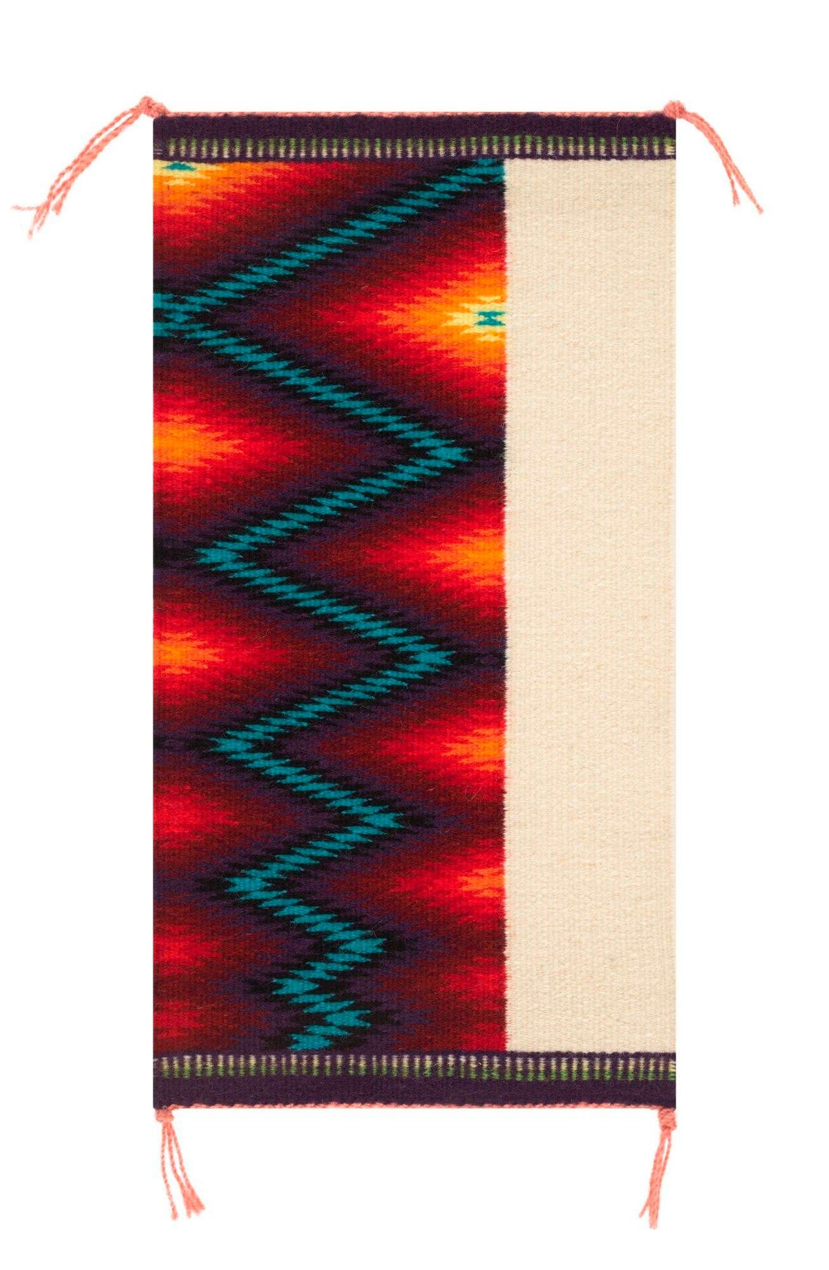 A long wall hanging woven by artist Melissa Cody. It is bisected by two patterns: a cream-colored slim block on the right side and a thicker, warm-colored block with a blue zig-zag pattern on the left side.