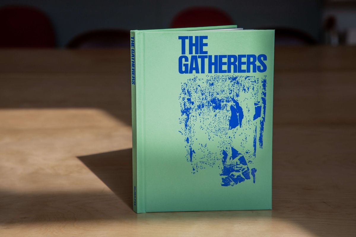 A photo of a green book which says The Gatherers