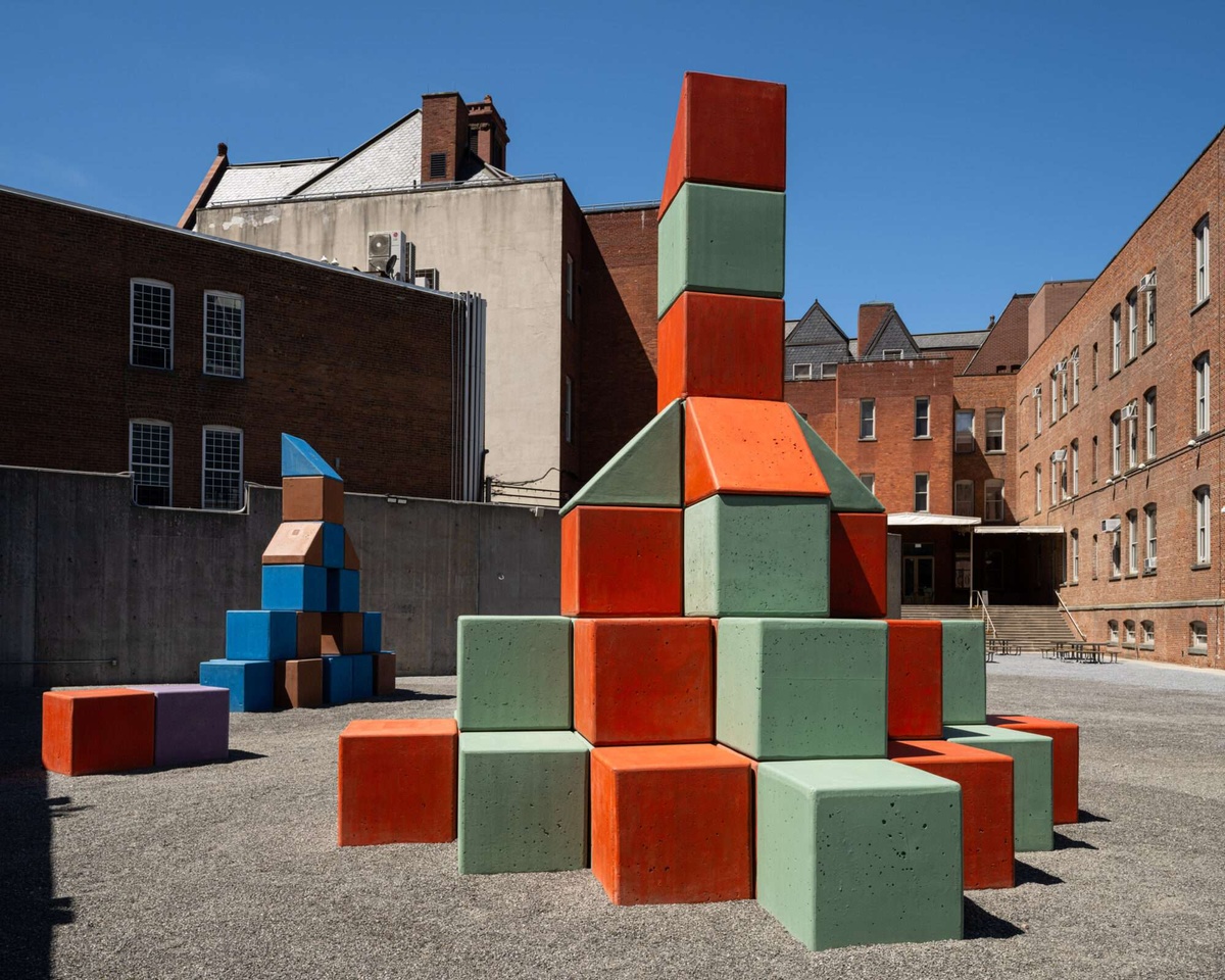An outdoor sculpture by Yto Barrada composed of giant color concrete blocks.